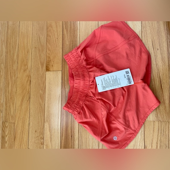 LULULEMON TRACKER LR SHORTS 4’ LINED, WMCO (sunset orange color) - Picture 2 of 2